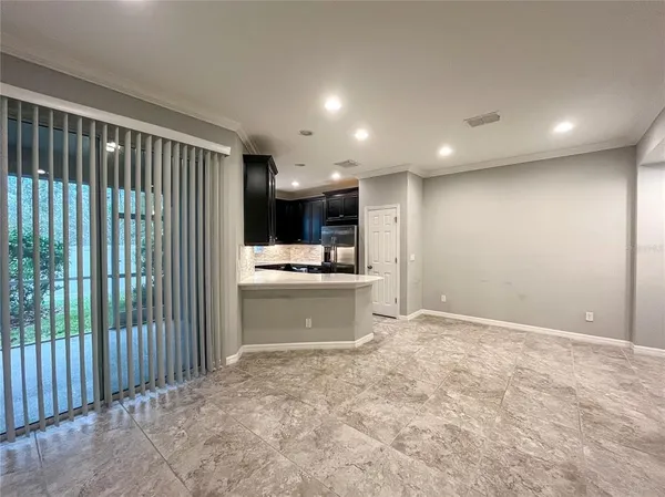 a view of a kitchen with a sink and cabinets