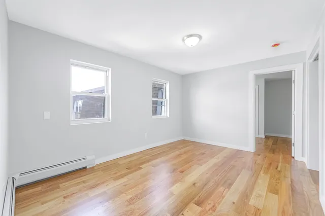 a bathroom with a sink toilet vanity and bathtub