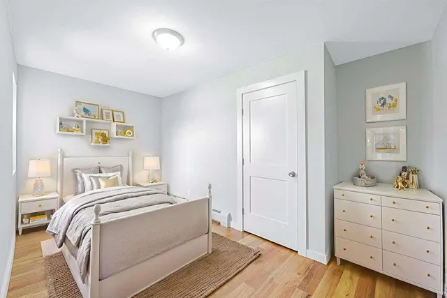 a view of room with wooden floor