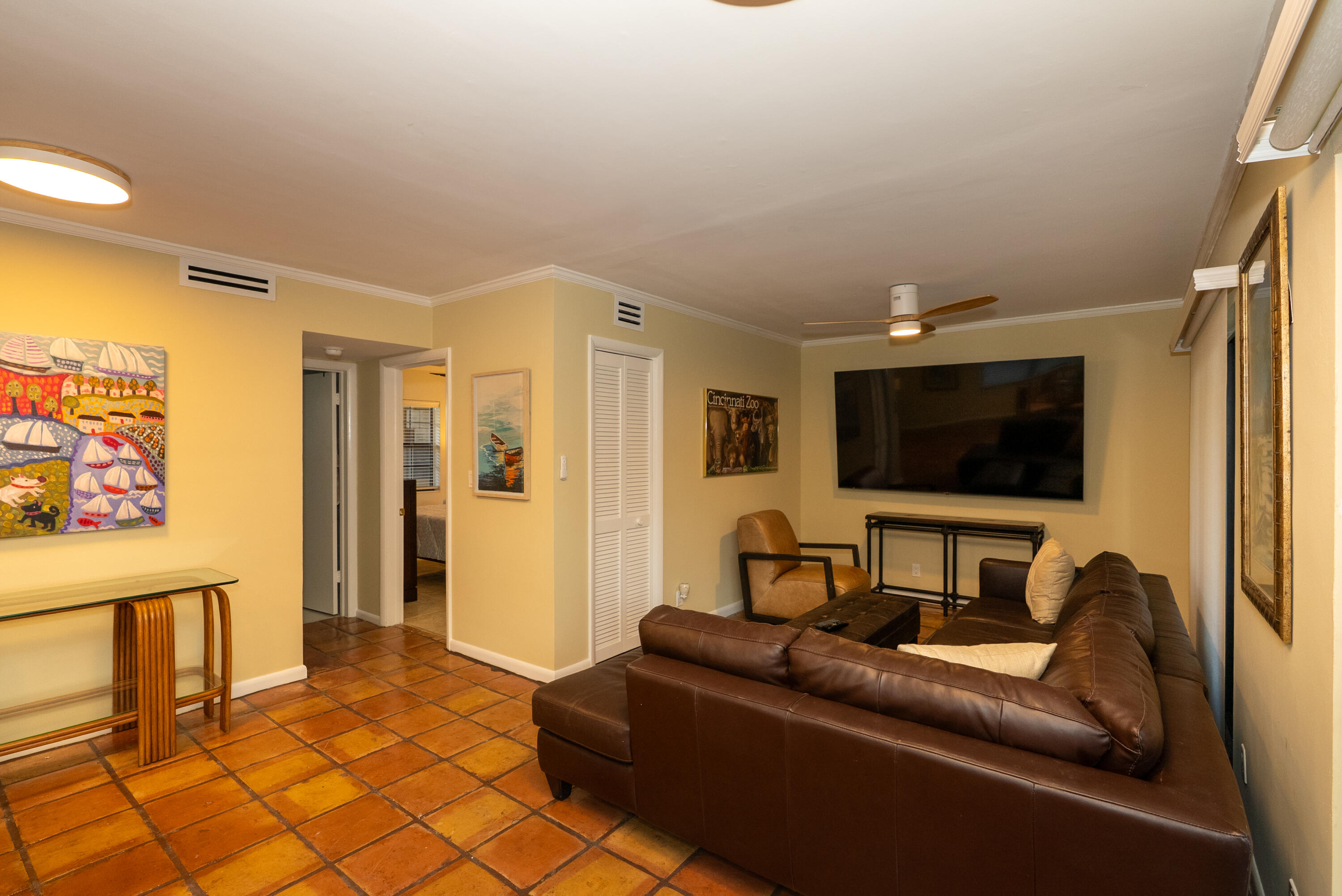 300 Inlet Way, Unit 2 Palm Beach Shores, FL 33404 - Photo 11 of 18 a living room with furniture and a flat screen tv