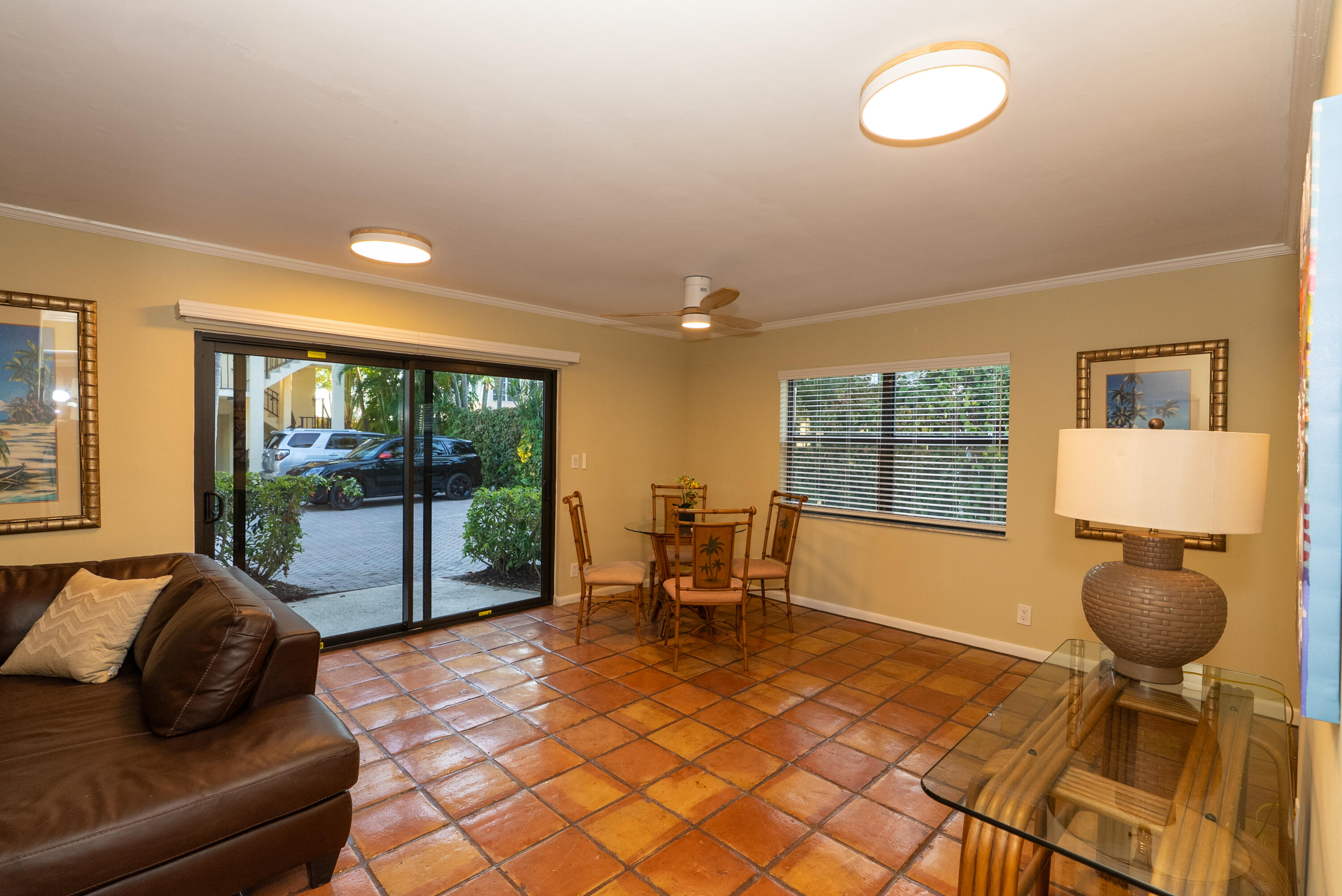 300 Inlet Way, Unit 2 Palm Beach Shores, FL 33404 - Photo 12 of 18 a living room with furniture and a large window