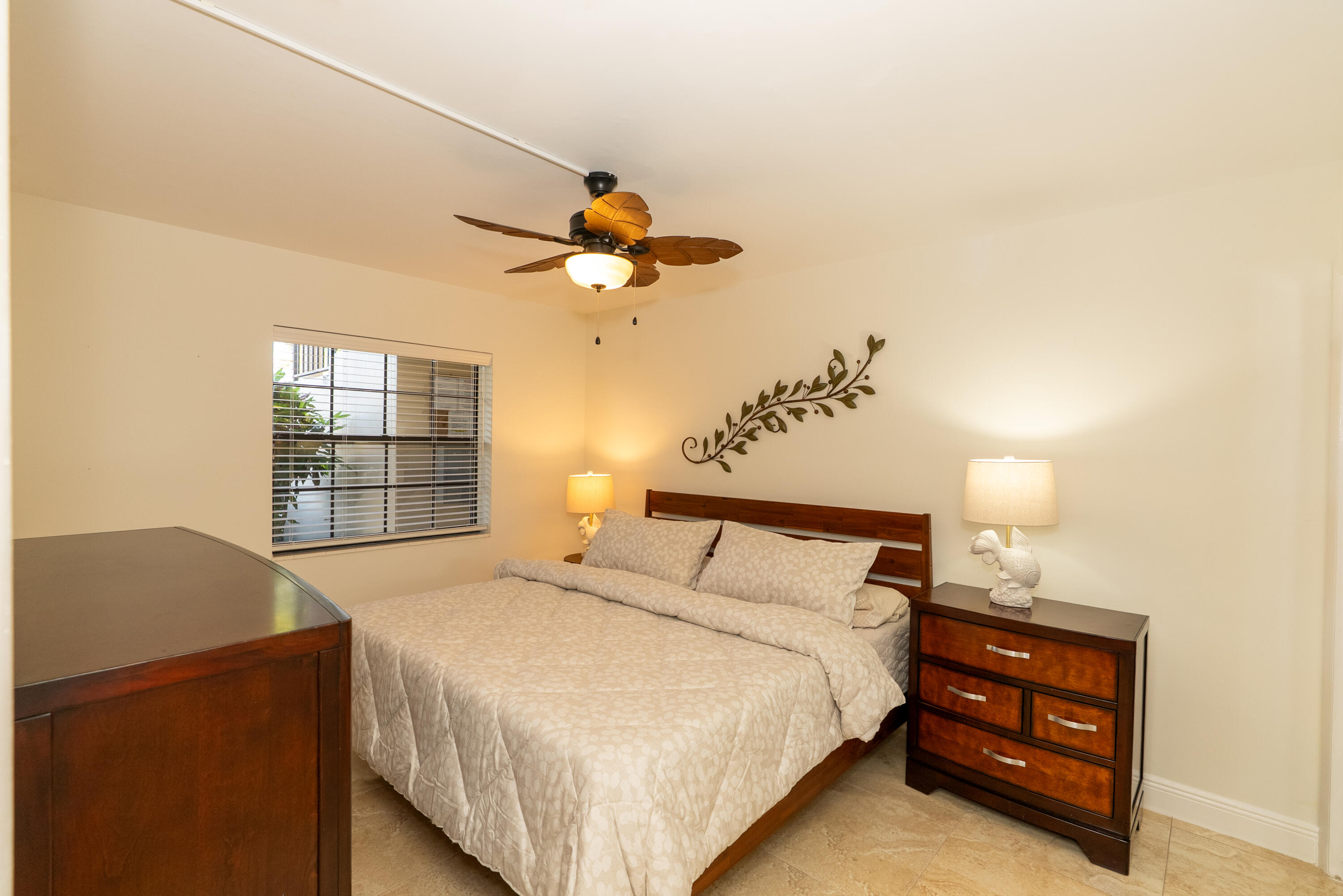 300 Inlet Way, Unit 2 Palm Beach Shores, FL 33404 - Photo 13 of 18 a bedroom with a bed and a window