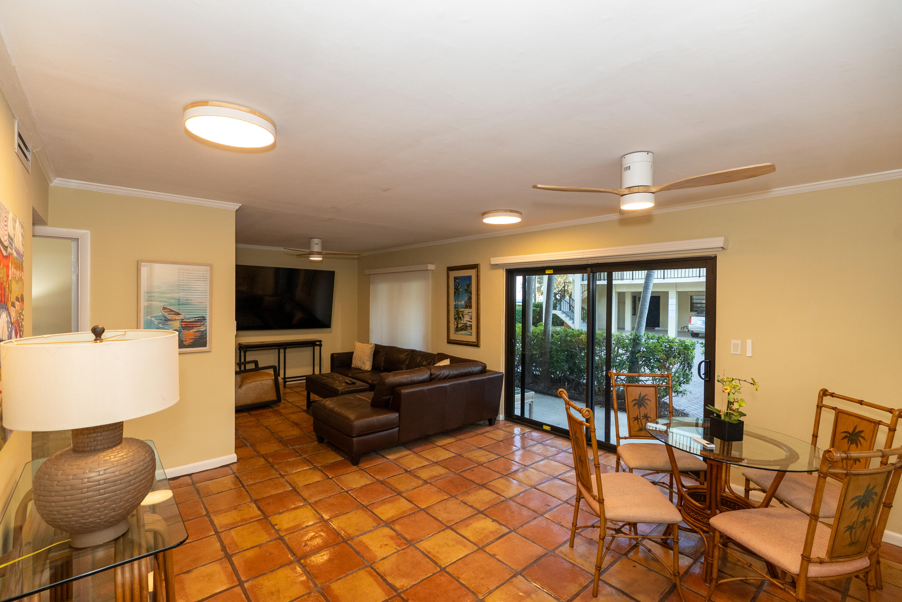 300 Inlet Way, Unit 2 Palm Beach Shores, FL 33404 - Photo 9 of 18 a living room with furniture and a flat screen tv