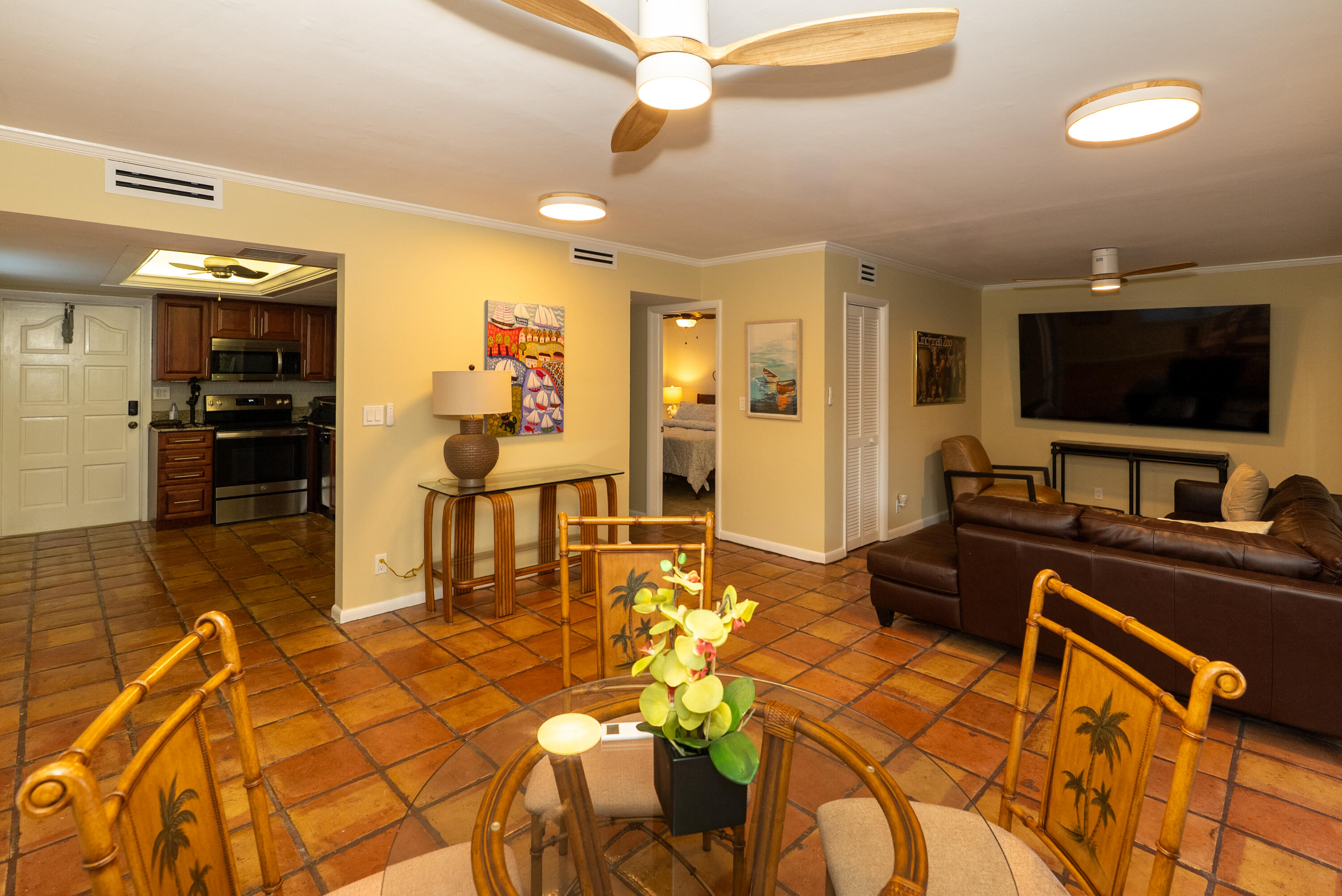 300 Inlet Way, Unit 2 Palm Beach Shores, FL 33404 - Photo 10 of 18 a living room filled with furniture and a flat screen tv