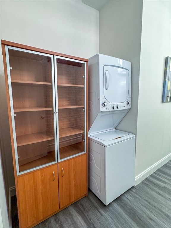19 Stanhope Street, Unit 2A Boston, MA 02116 - Photo 14 of 14 a utility room with wooden floor washer and dryer
