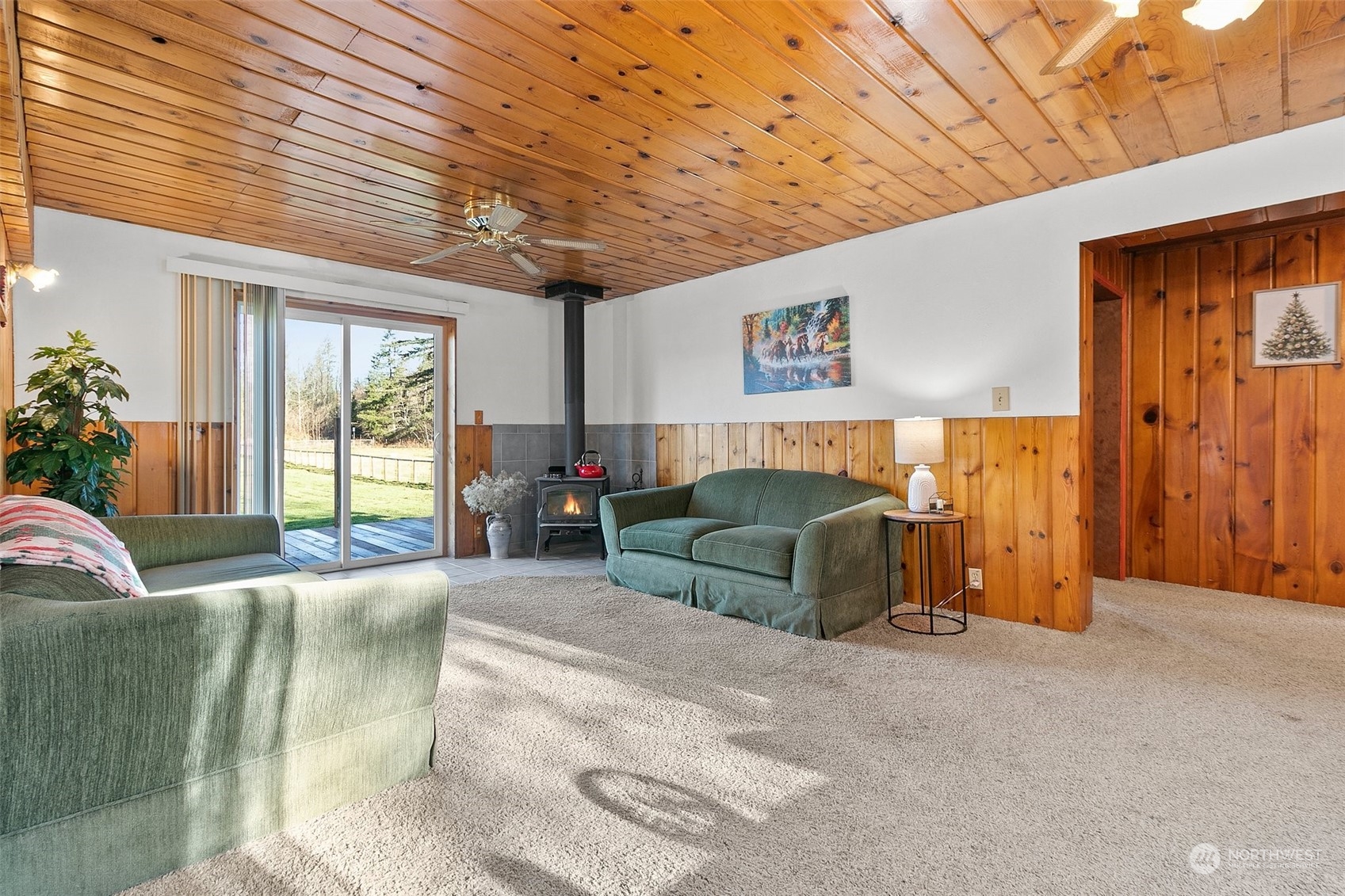 21650 Sweeney Road Southeast Maple Valley, WA 98038 - Photo 13 of 36 a living room with furniture and a large window