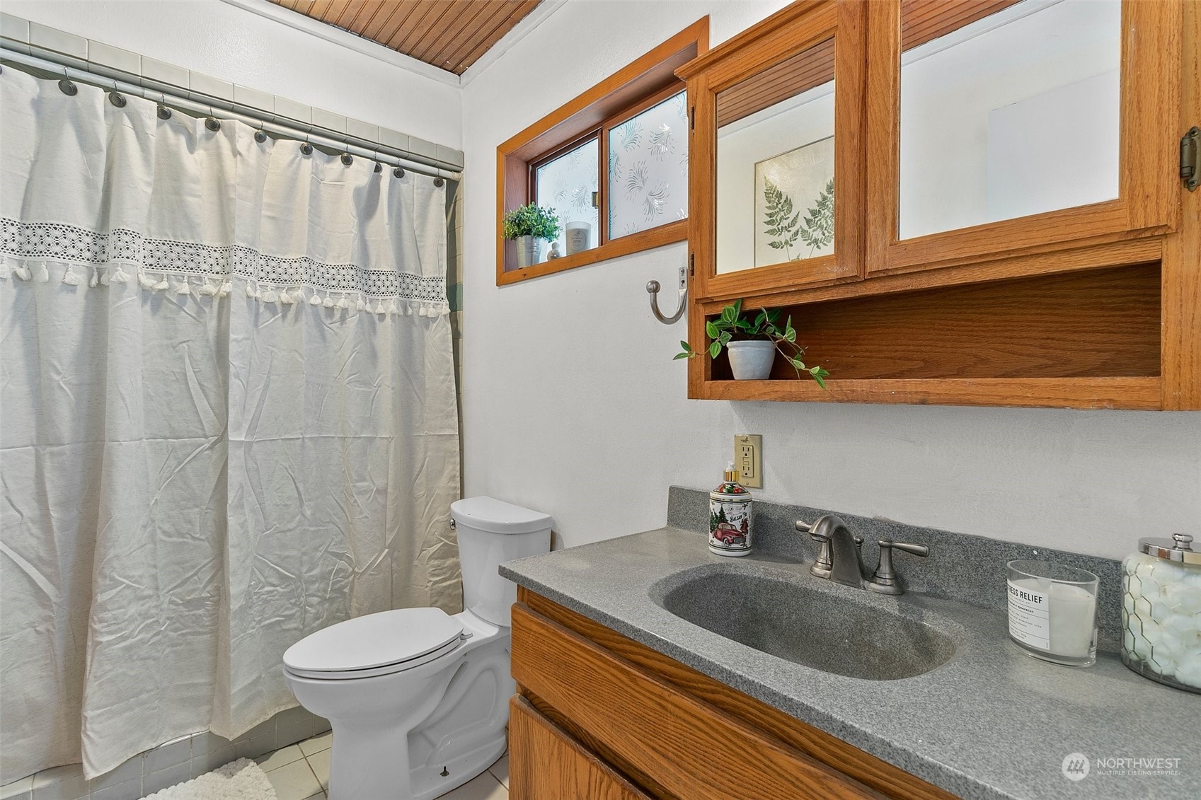 21650 Sweeney Road Southeast Maple Valley, WA 98038 - Photo 17 of 36 a bathroom with a granite countertop sink and a toilet