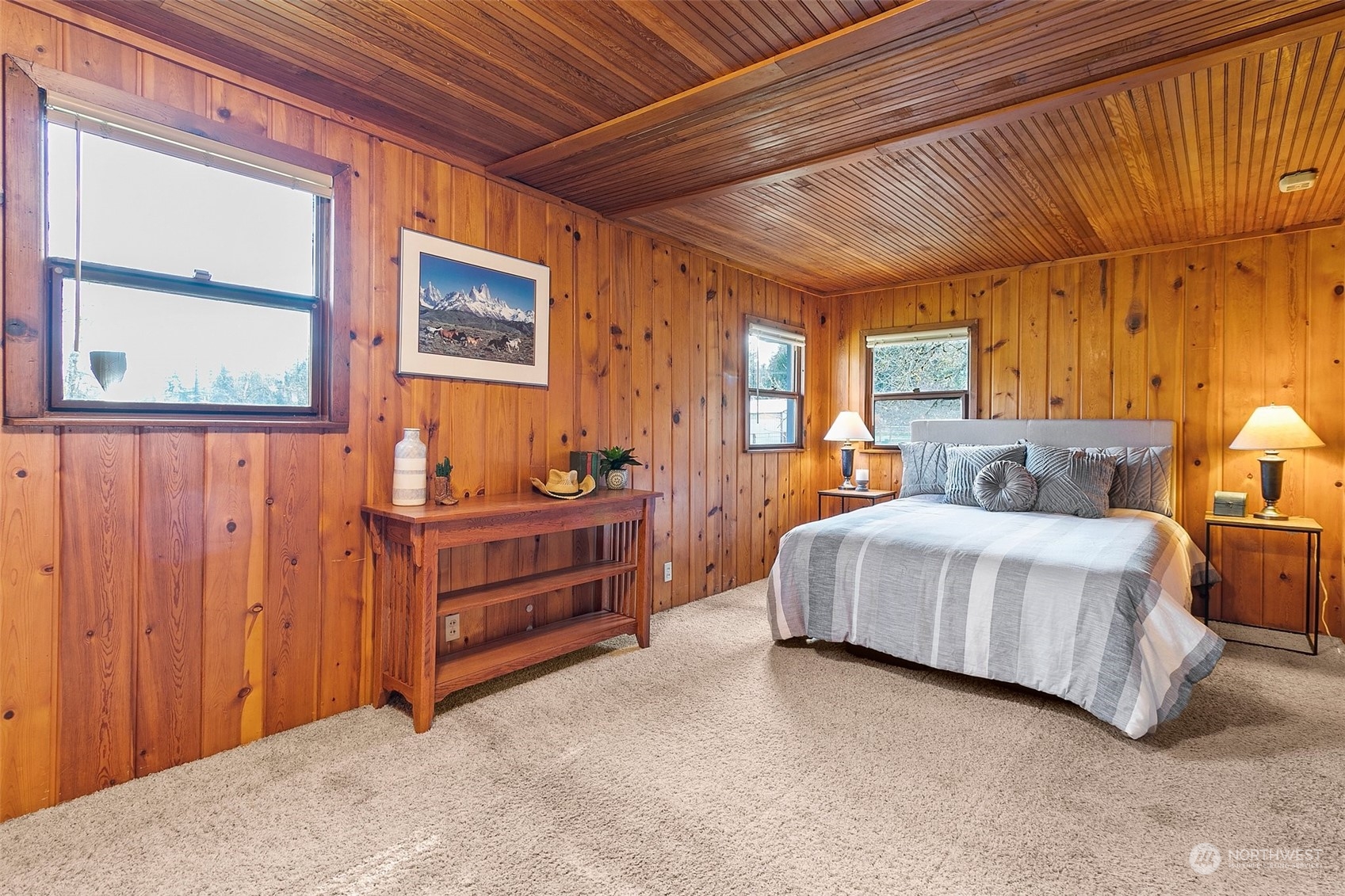 21650 Sweeney Road Southeast Maple Valley, WA 98038 - Photo 18 of 36 a spacious bedroom with a bed and a window