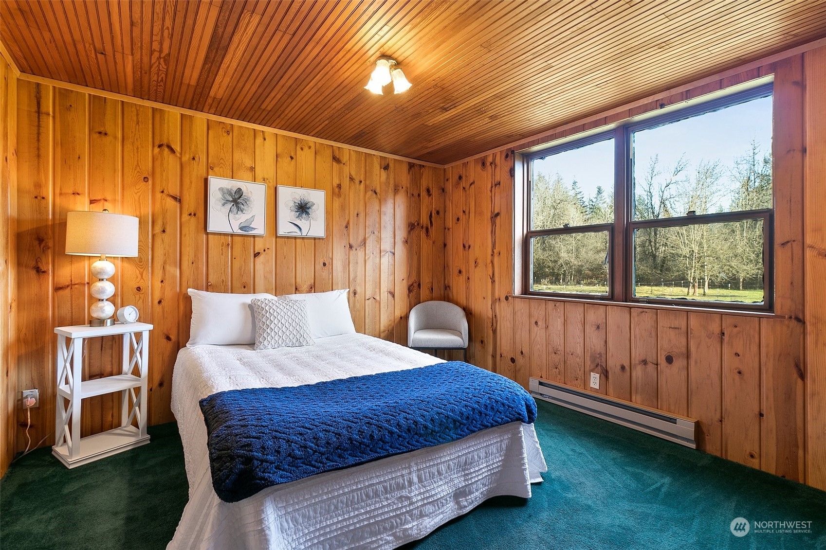 21650 Sweeney Road Southeast Maple Valley, WA 98038 - Photo 21 of 36 a bedroom with a bed and a window