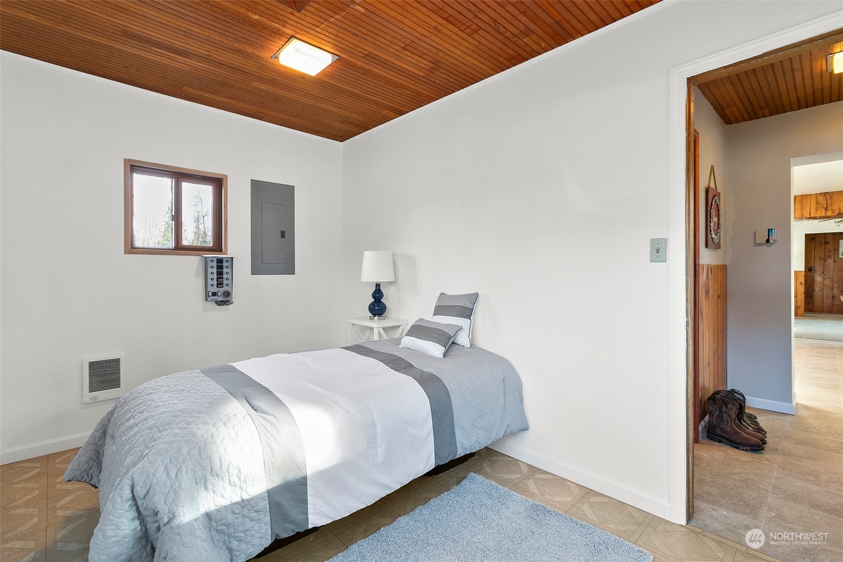 21650 Sweeney Road Southeast Maple Valley, WA 98038 - Photo 22 of 36 a bedroom with a bed and a walk in closet