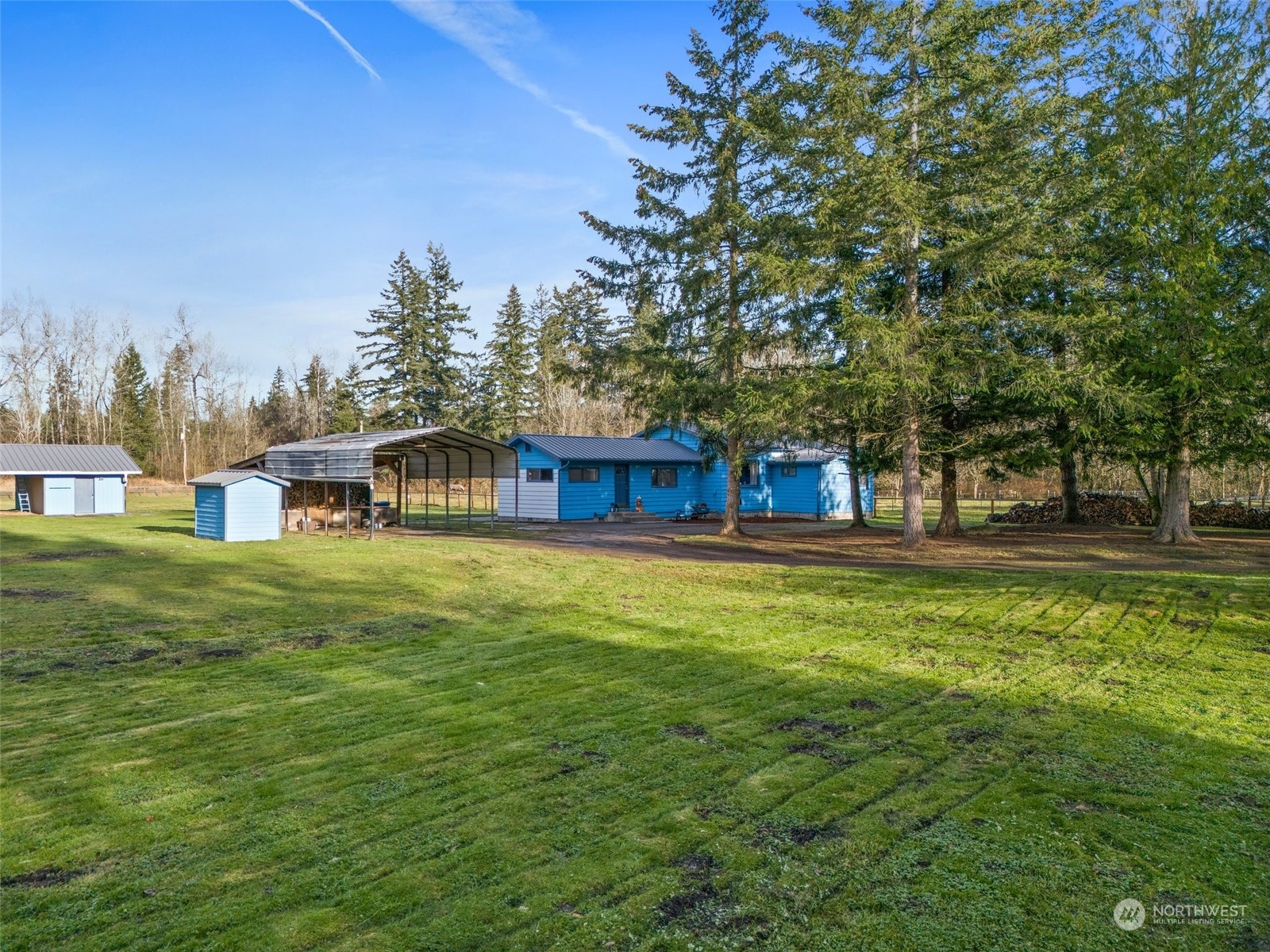 21650 Sweeney Road Southeast Maple Valley, WA 98038 - Photo 34 of 36 a view of a house with a yard