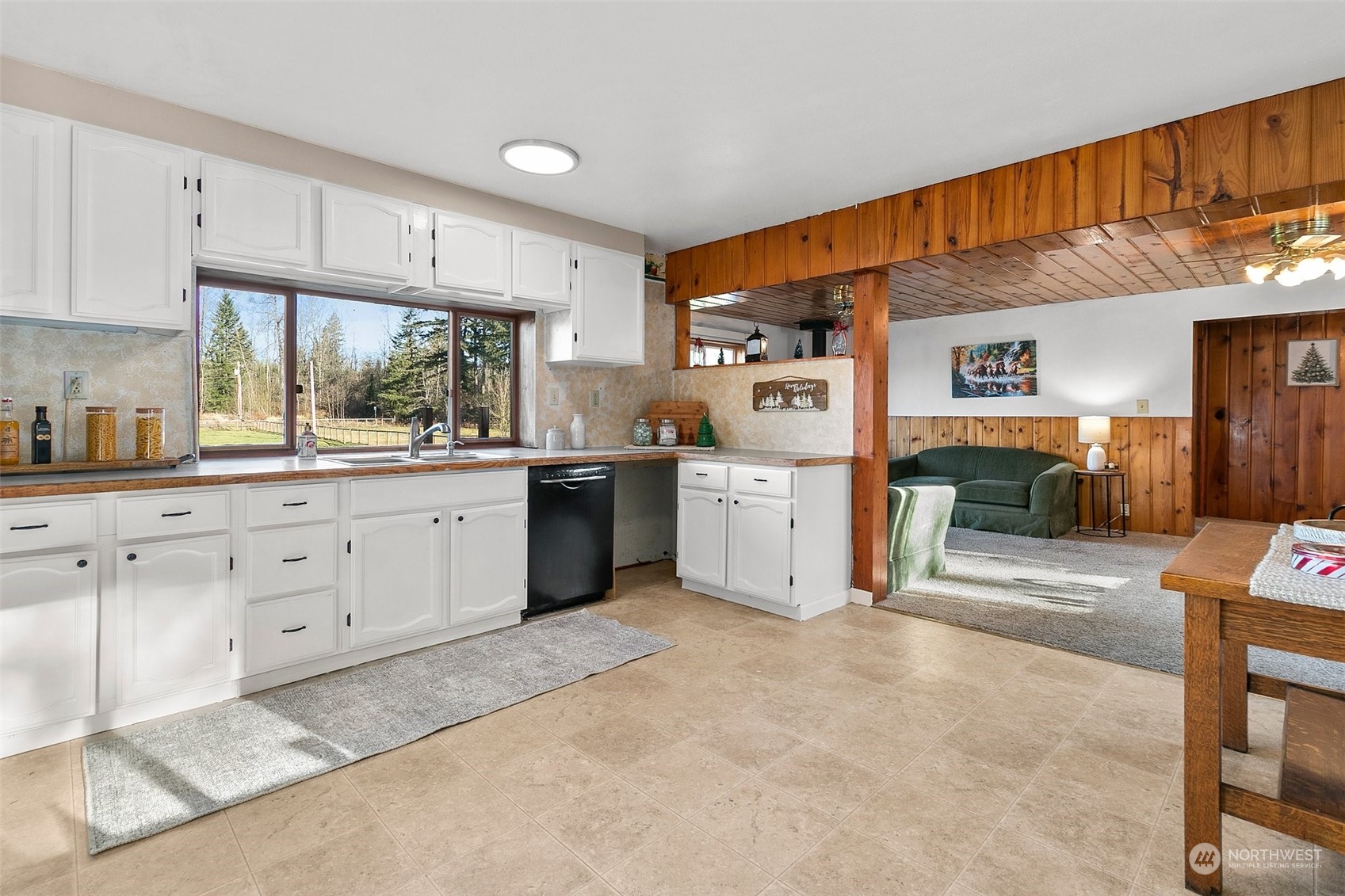 21650 Sweeney Road Southeast Maple Valley, WA 98038 - Photo 7 of 36 a kitchen with white cabinets and white appliances