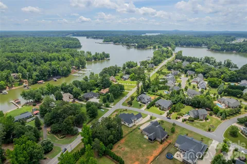 an aerial view of residential house with outdoor space and lake view