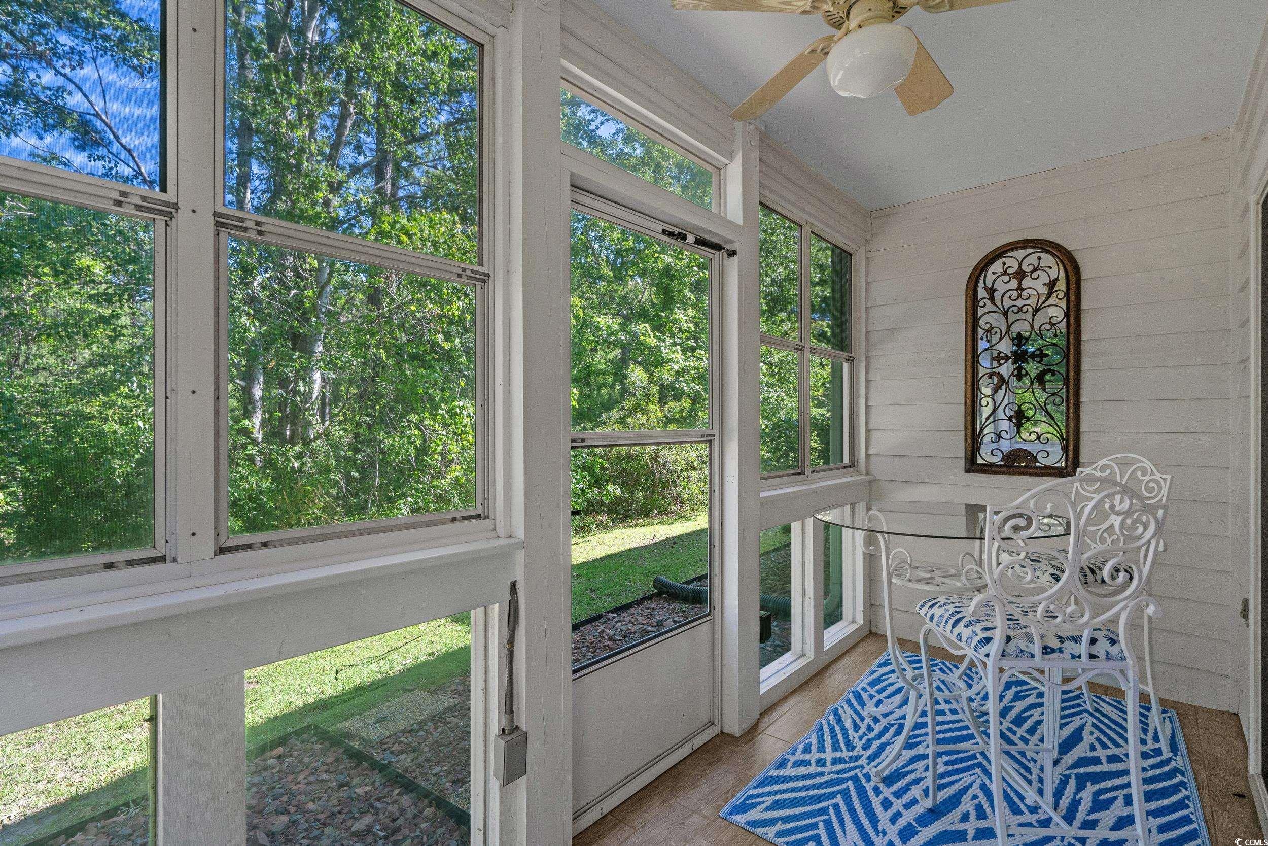 1290 White Tree Lane Myrtle Beach, SC 29588 - Photo 15 of 33 Kitchen with appliances with stainless steel finishes, gray cabinetry, a textured ceiling, dark wood-type flooring, and backsplash