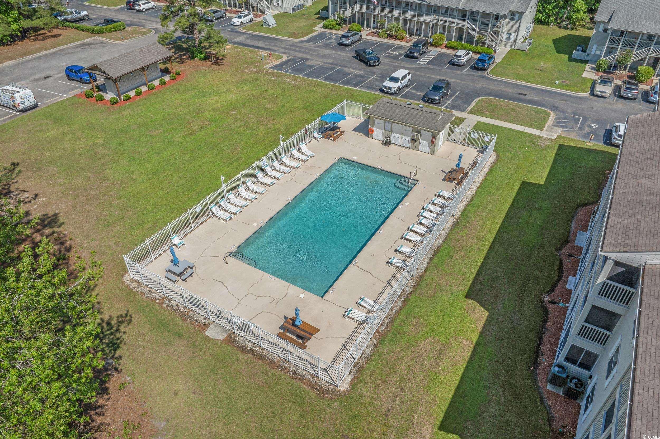 1290 White Tree Lane Myrtle Beach, SC 29588 - Photo 30 of 33 Kitchen view of backsplash, stainless steel appliances, light stone counters, and gray cabinetry