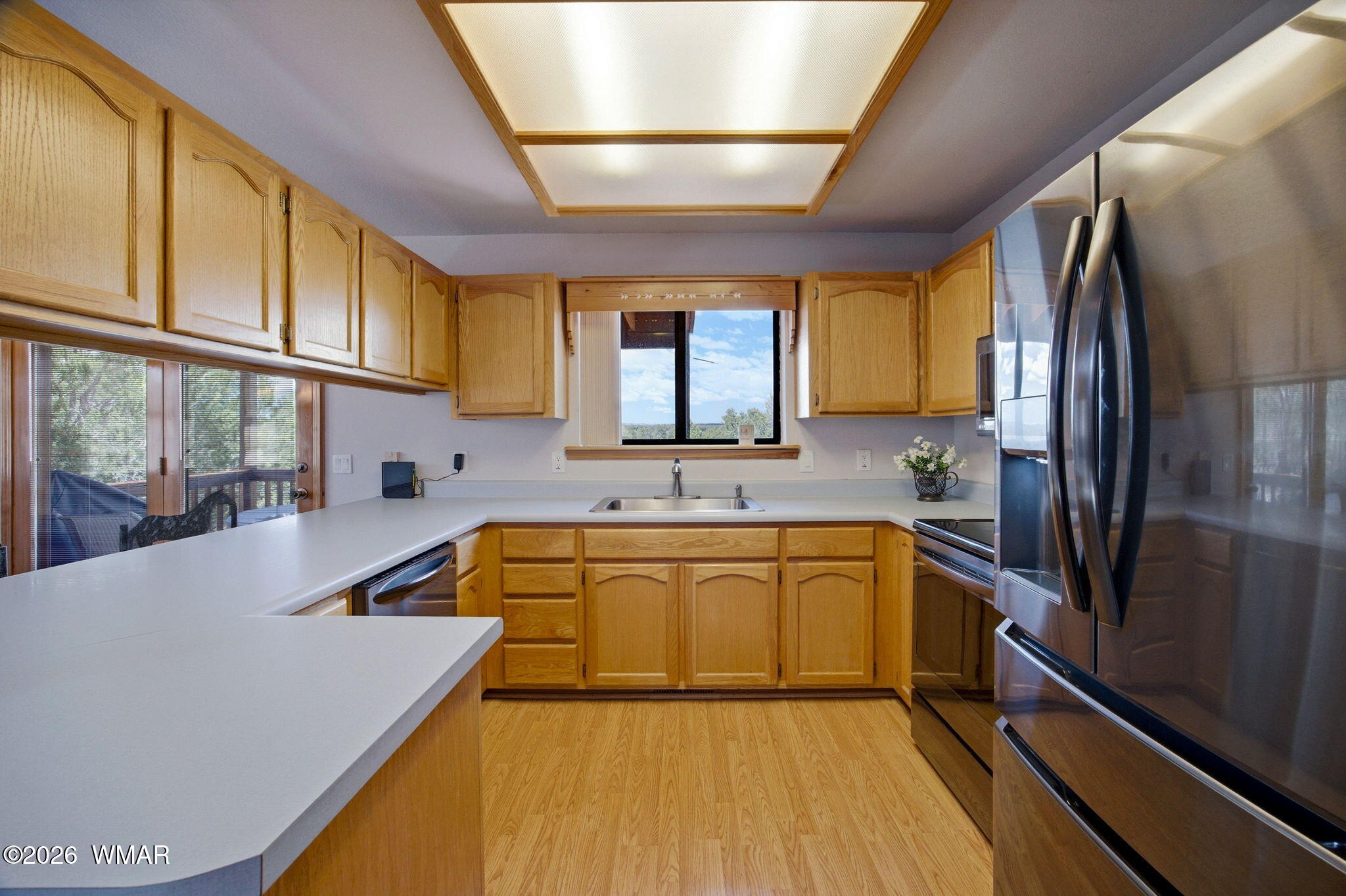 2806 Sky Hawk Drive Overgaard, AZ 85933 - Photo 16 of 43 a kitchen with stainless steel appliances granite countertop a sink a stove and refrigerator