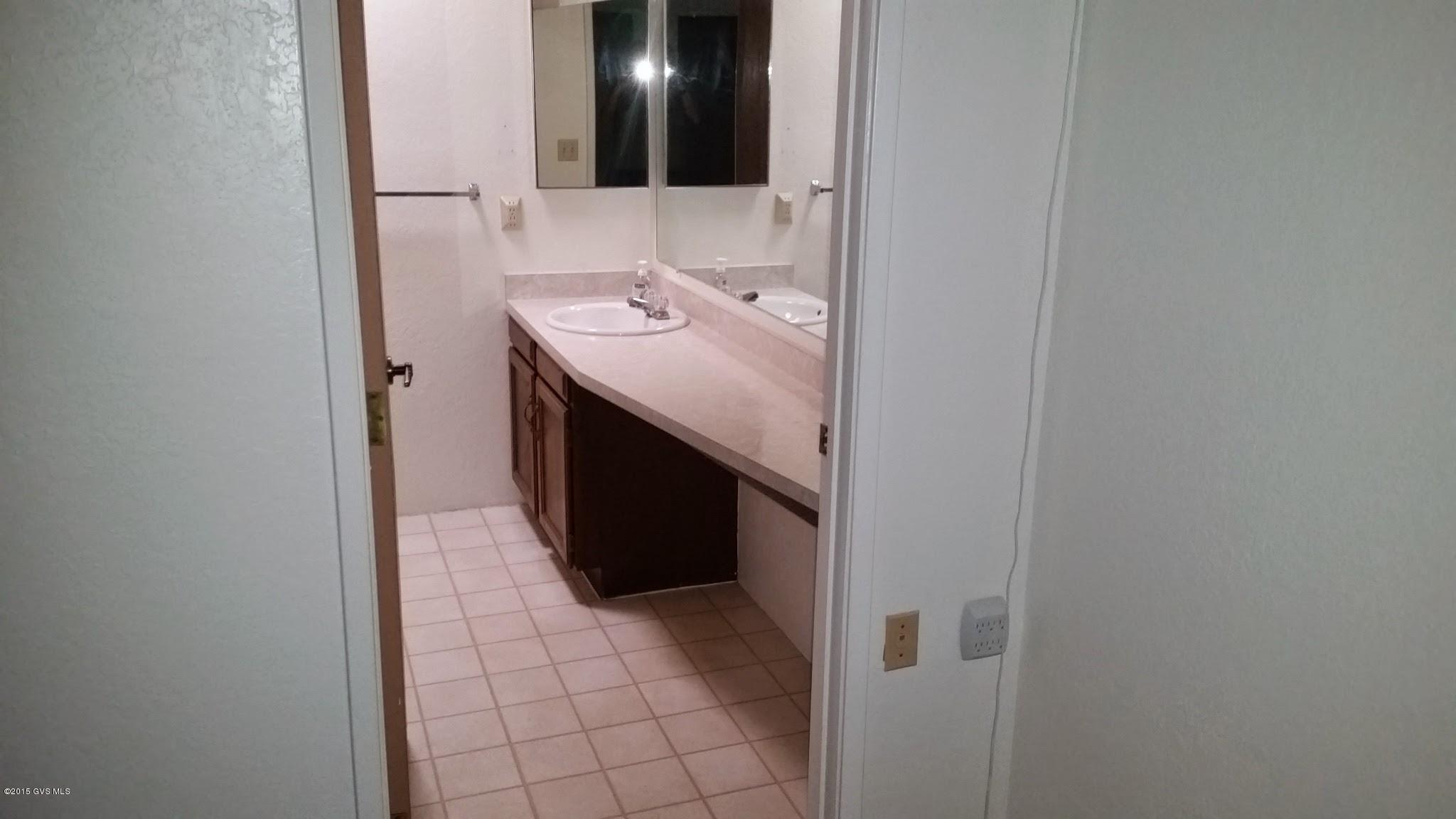 622 West Rio San Pedro Green Valley, AZ 85614 - Photo 13 of 16 a bathroom with a sink and a mirror