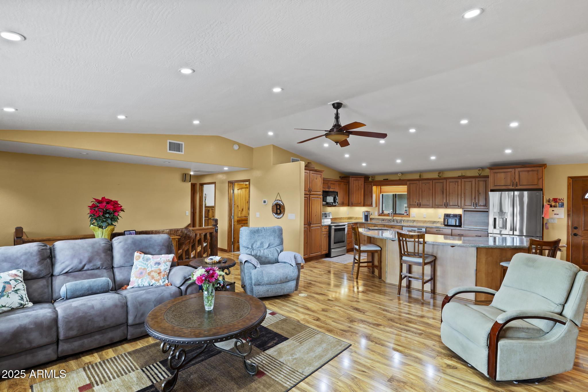 804 East Phoenix Street Payson, AZ 85541 - Photo 13 of 56 a living room with furniture kitchen and a chandelier