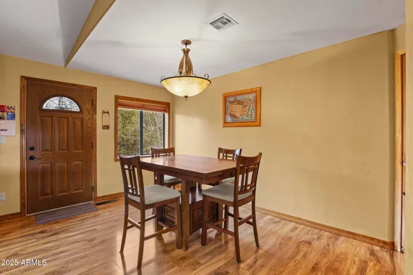 a bedroom with furniture and a wooden floor