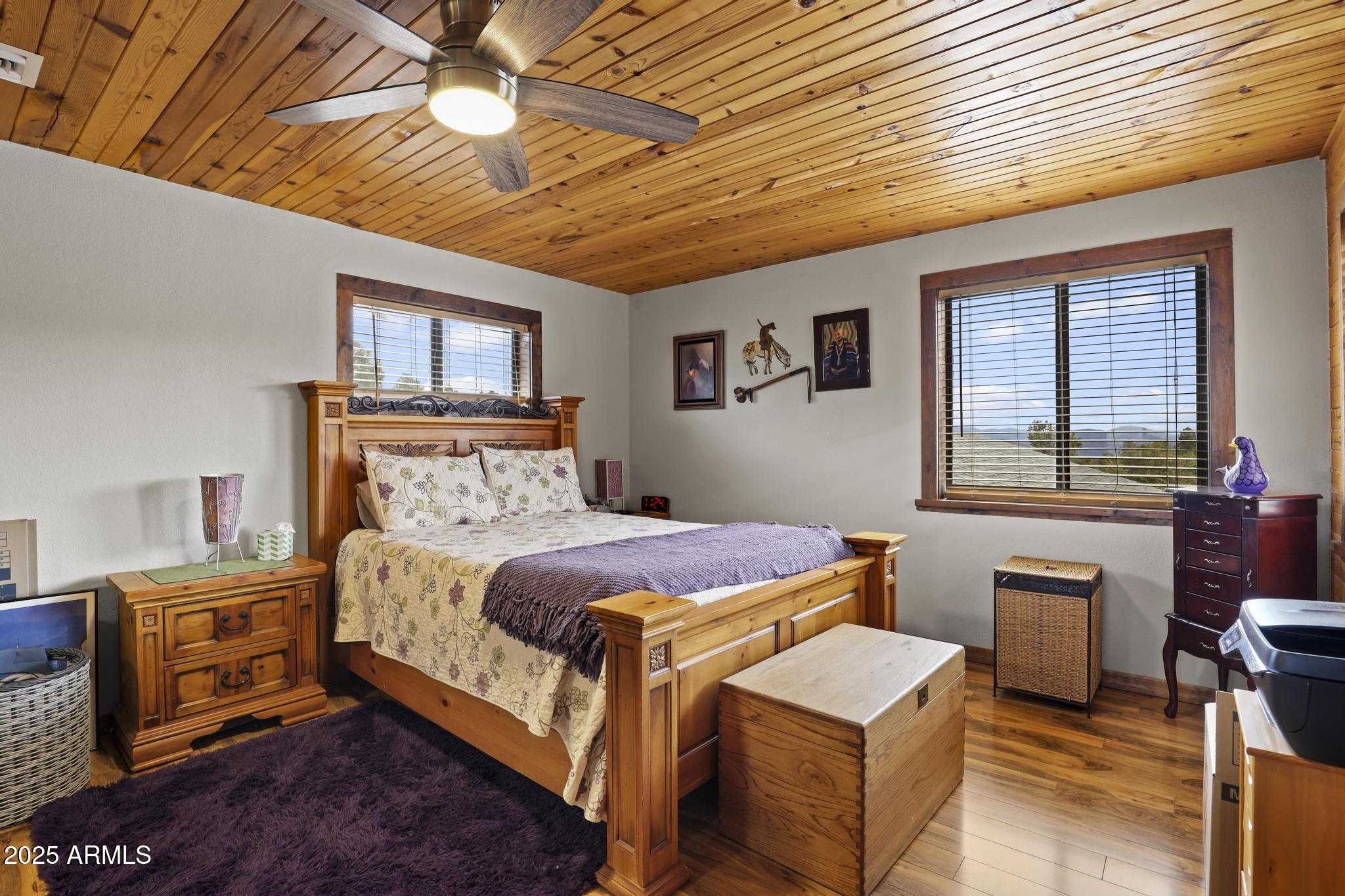 804 East Phoenix Street Payson, AZ 85541 - Photo 18 of 56 a bedroom with a bed and a dresser next to a window