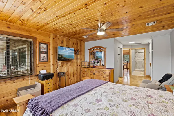 a view of walk in closet with clothes