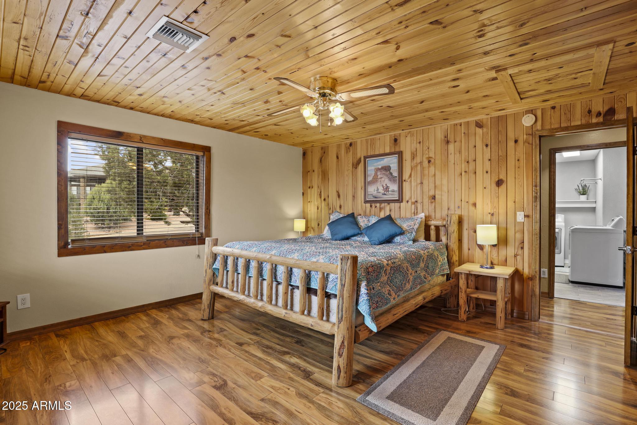 804 East Phoenix Street Payson, AZ 85541 - Photo 23 of 56 a bedroom with a bed and wooden floor