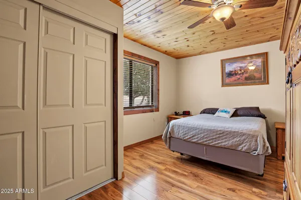 a bed room with a bed and a dresser