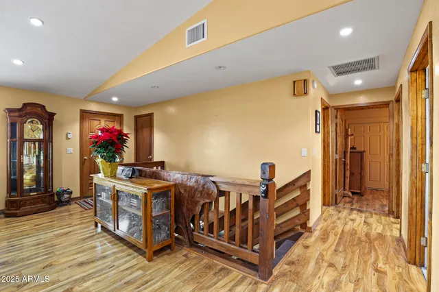 a dining room with furniture and wooden floor