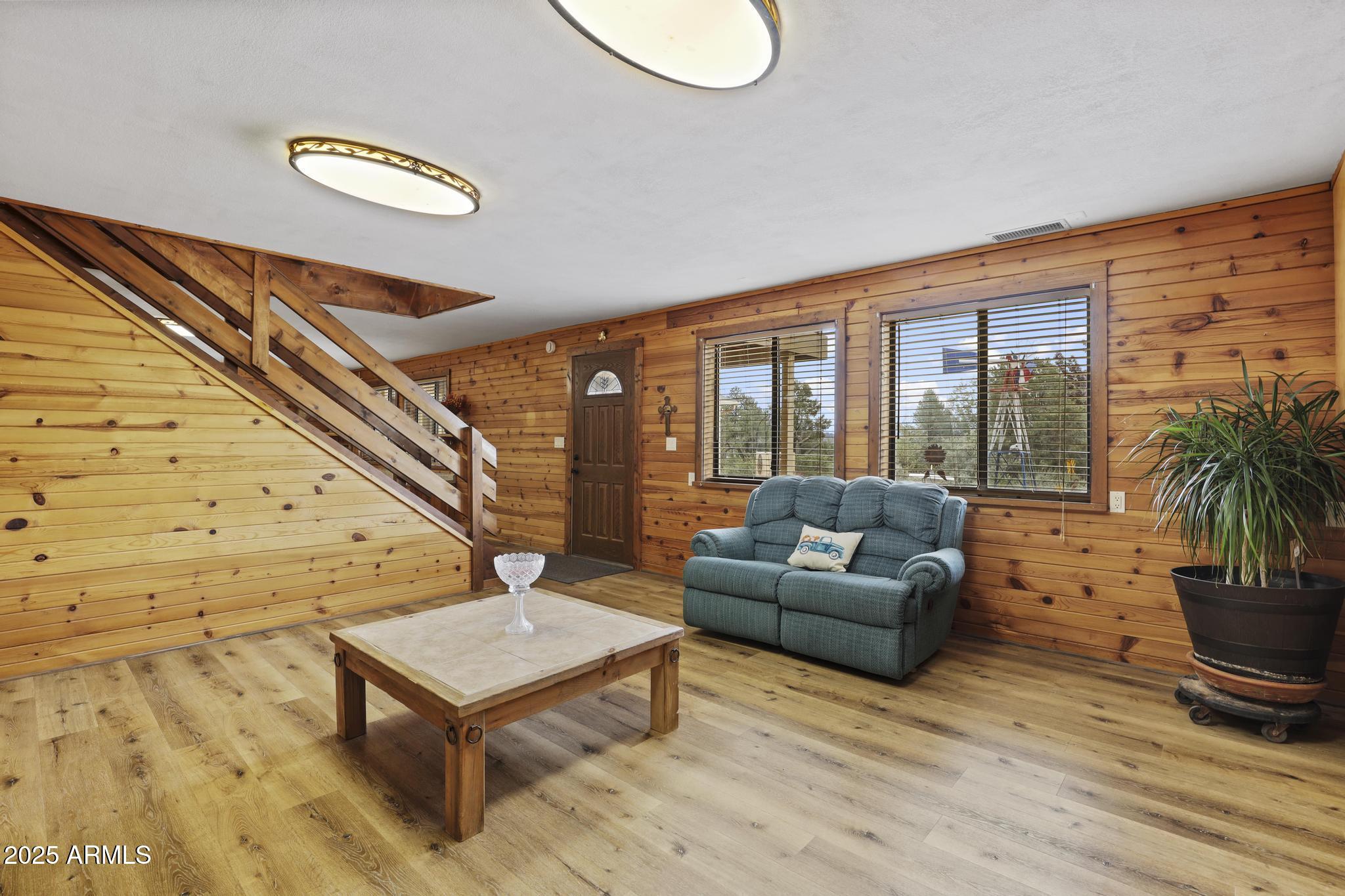804 East Phoenix Street Payson, AZ 85541 - Photo 29 of 56 a living room with furniture and a floor to ceiling window