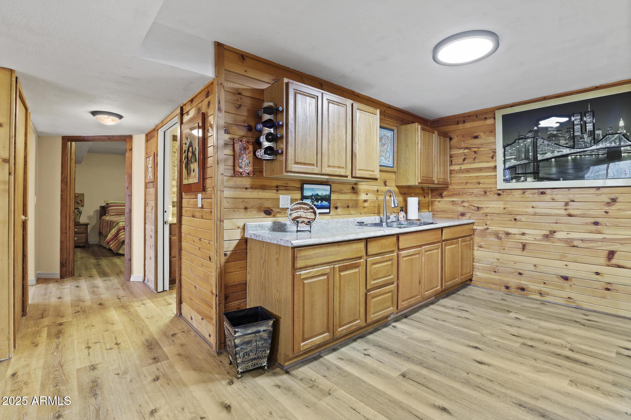 804 East Phoenix Street Payson, AZ 85541 - Photo 38 of 56 a kitchen with granite countertop a sink cabinets and wooden floor