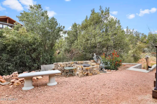 a view of a patio with furniture and a yard