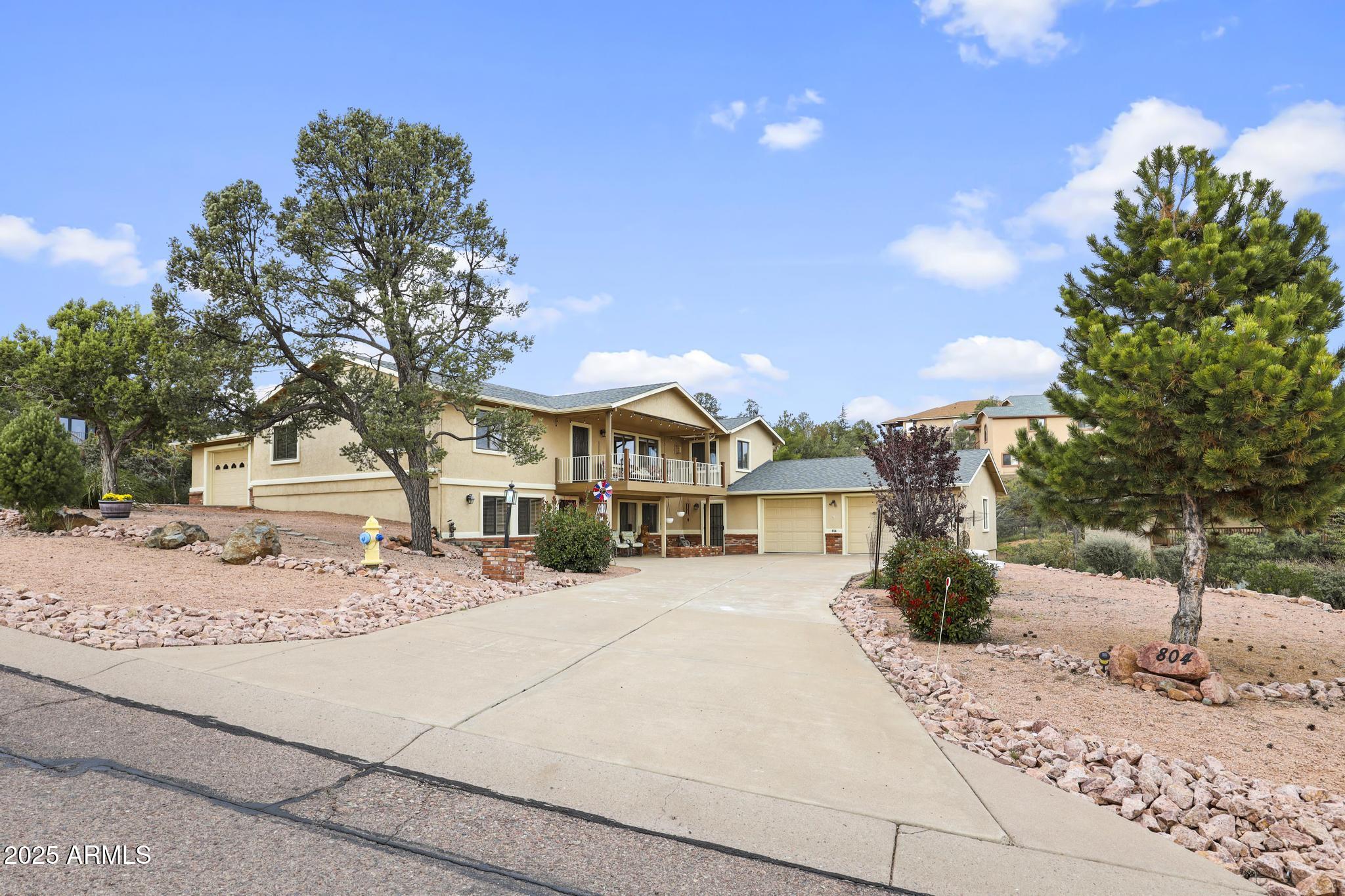 804 East Phoenix Street Payson, AZ 85541 - Photo 54 of 56 a view of a white house with a yard and sitting area