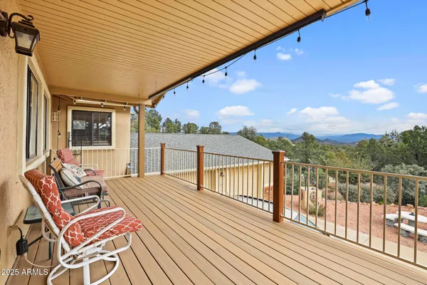 a view of a balcony with wooden fence