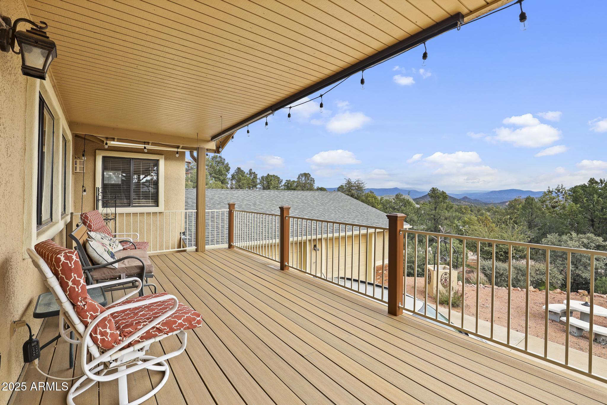 804 East Phoenix Street Payson, AZ 85541 - Photo 6 of 56 a balcony with wooden floor table and chairs