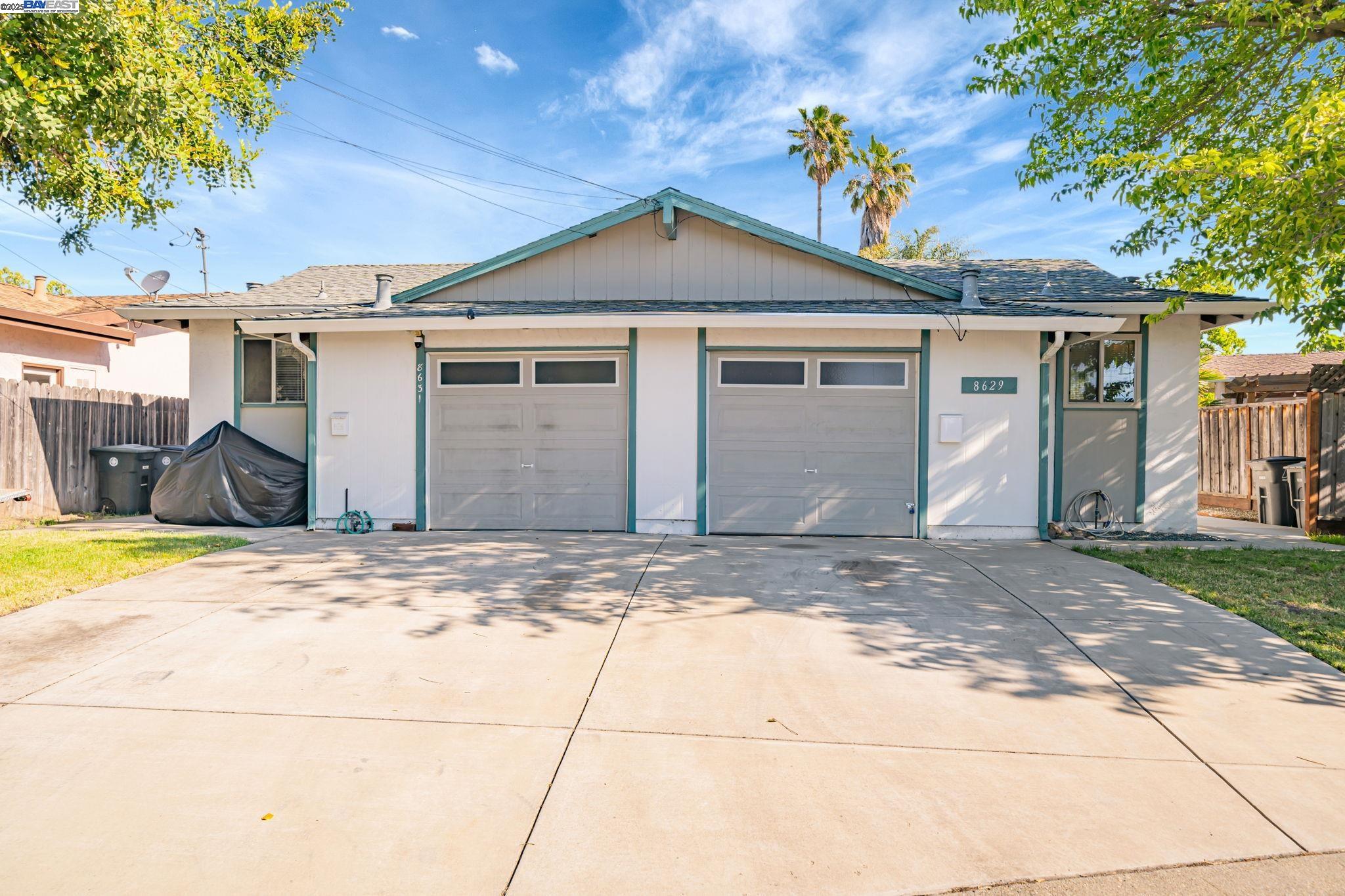 8629 Beverly Lane Dublin, CA 94568 - Photo 1 of 1 a front view of a house with a yard and garage