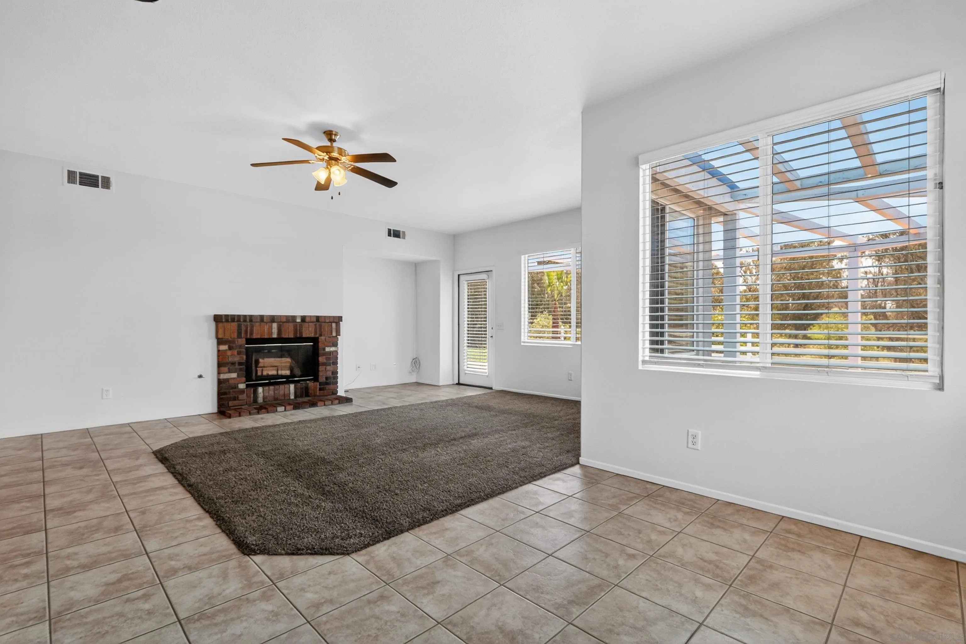 1432 Belmont Park Road Oceanside, CA 92057 - Photo 26 of 54 a bed room with a bed and a book shelf