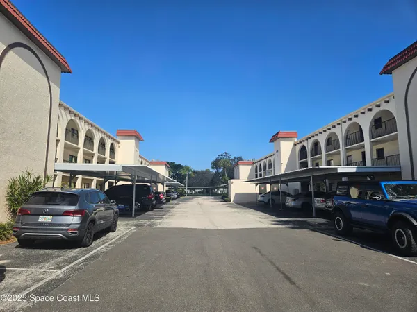 a view of a cars parked in front of a house