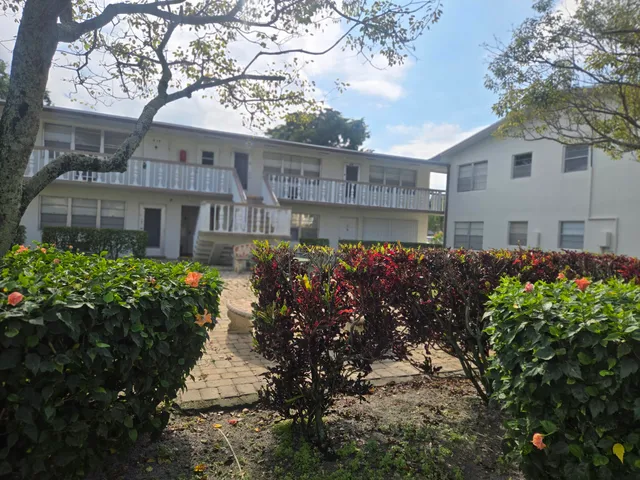 a view of a house with a garden