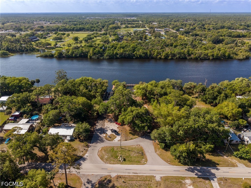 17290 Rewis Road Alva, FL 33920 - Photo 43 of 50 an aerial view of residential houses with outdoor space and lake view