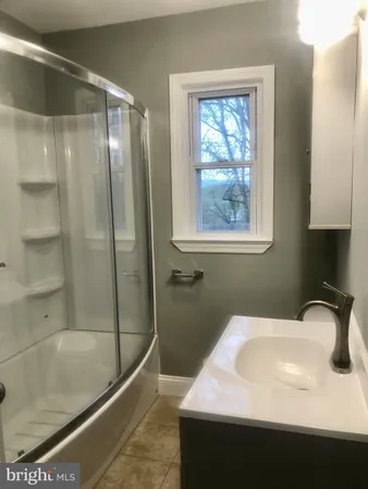 a bathroom with a sink and a bathtub