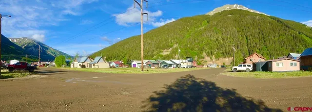 a view of a street with a building in the background