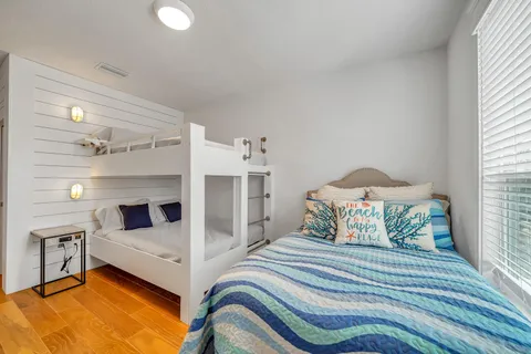 a bedroom with bed and window