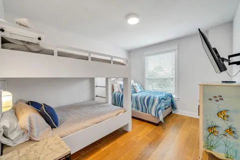 a bathroom with a double vanity sink and a window