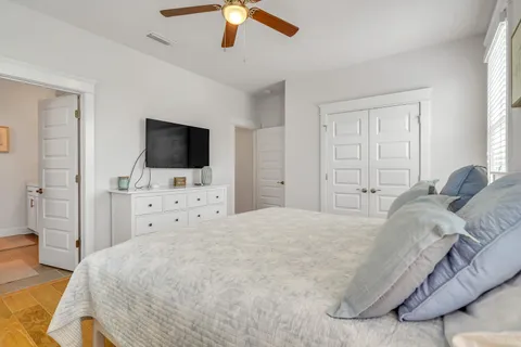 a bathroom with a toilet and a shower curtain