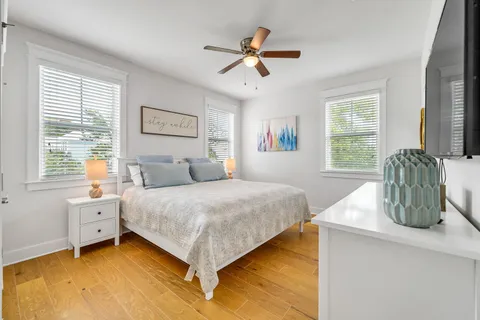 a bedroom with a bed and flat screen tv