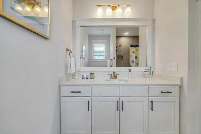 a bathroom with a sink and a shower