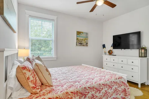 a bathroom with a sink toilet a mirror and shower
