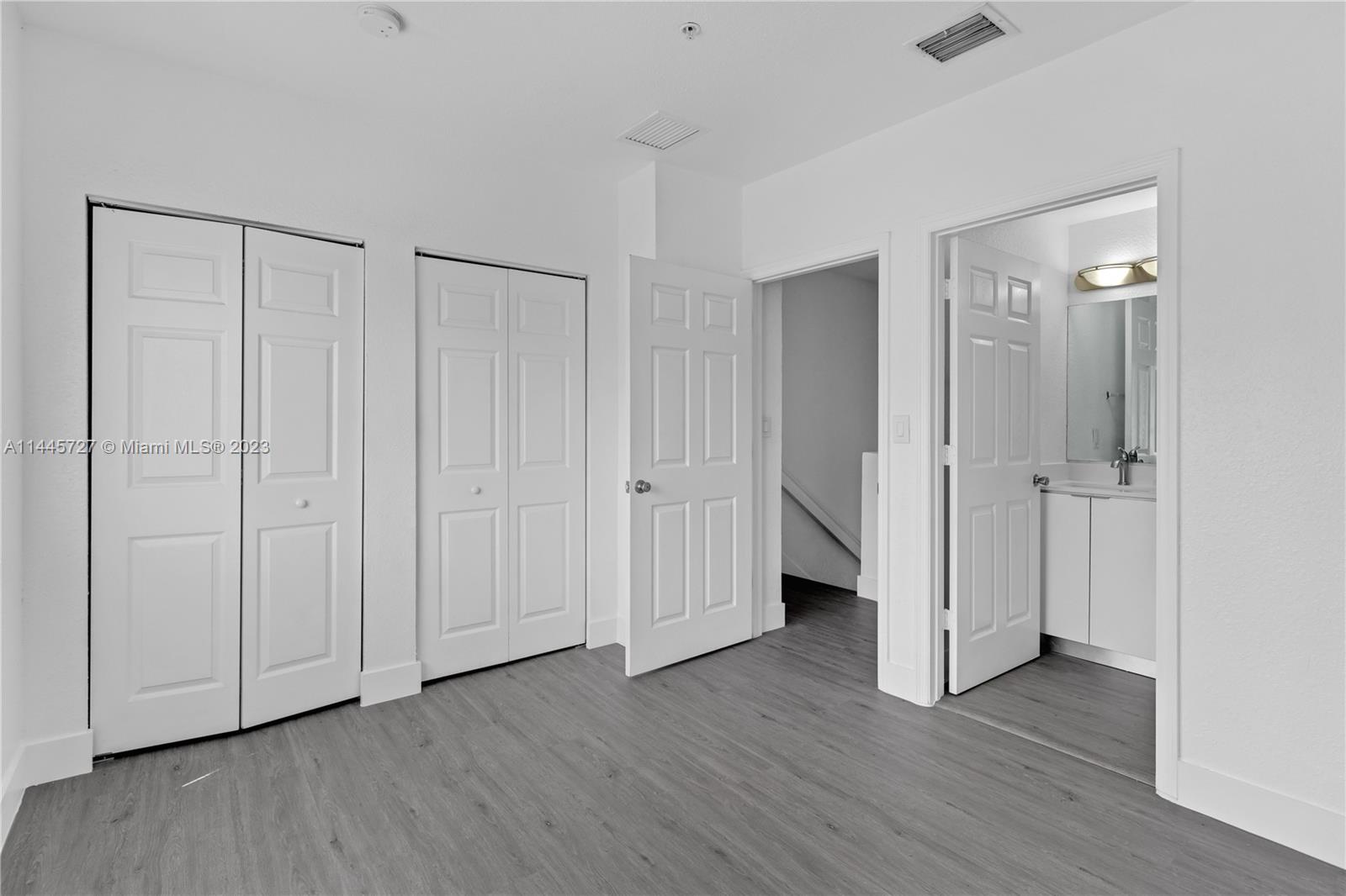 7989 Northwest 8th Street, Unit 110 Miami, FL 33126 - Photo 16 of 24 a view of a livingroom with wooden floor