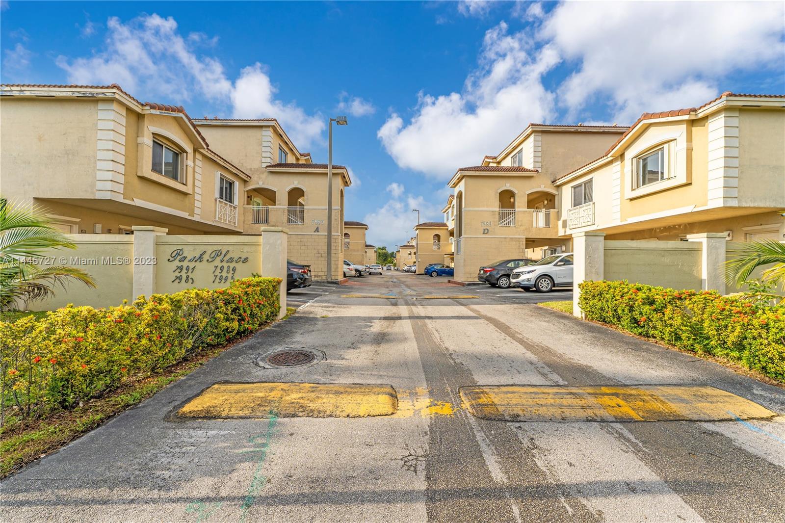 7989 Northwest 8th Street, Unit 110 Miami, FL 33126 - Photo 3 of 24 a city street lined with buildings and trees