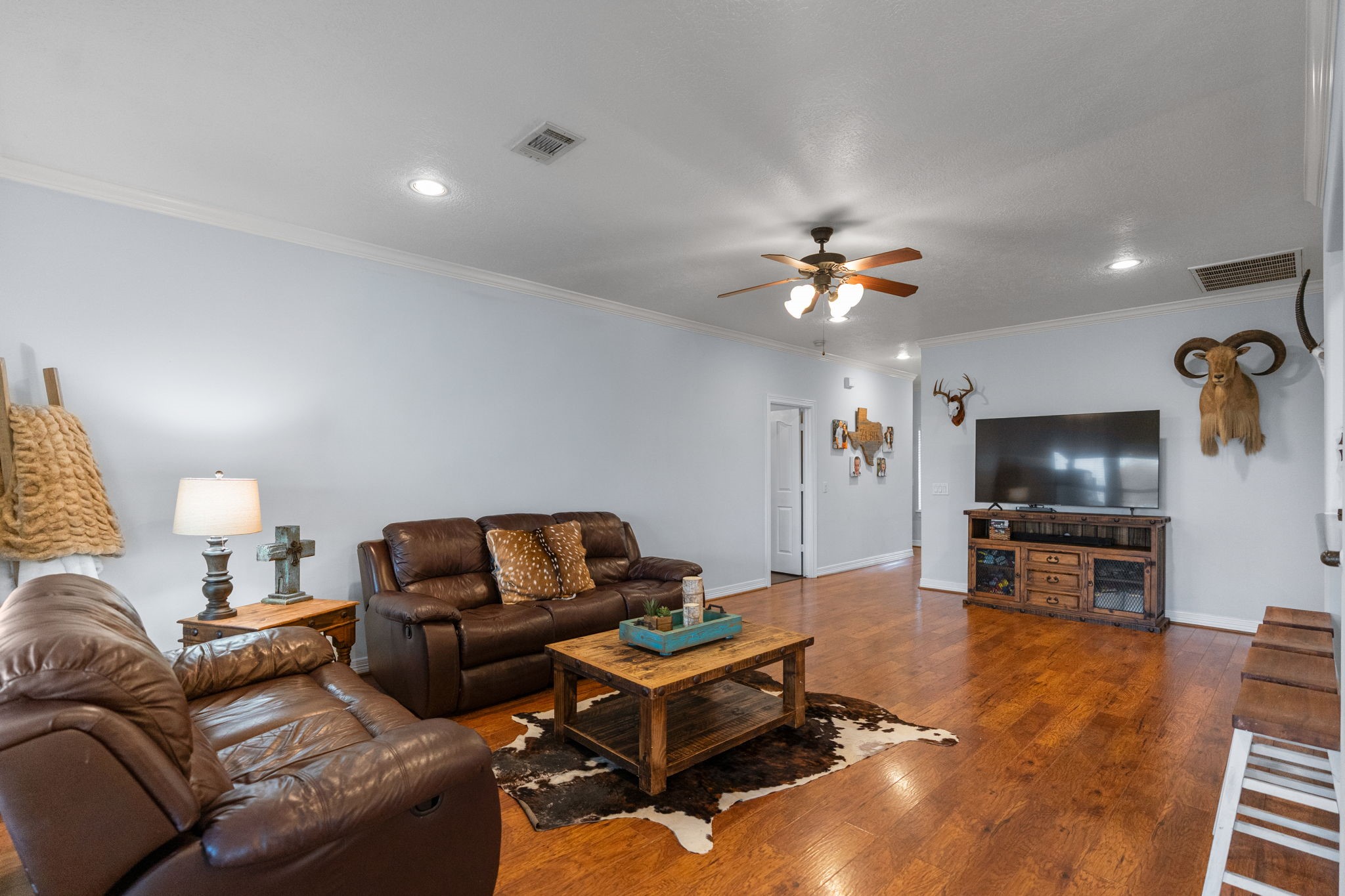 5942 Wildflower Road Sealy, TX 77474 - Photo 5 of 41 a living room with furniture and a flat screen tv